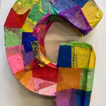 Letter 'G' in cardboard with tissue paper