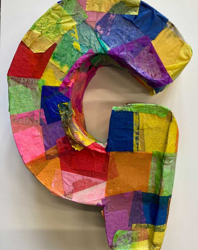 Letter 'G' in cardboard with tissue paper