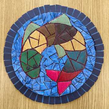 Mosaic style fish using cardboard, magazine paper and fruit netting