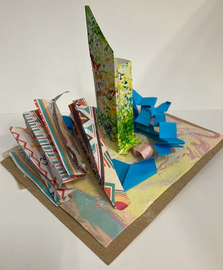 Paper sculpture using marbled paper, brusho sprayed paper and origami paper