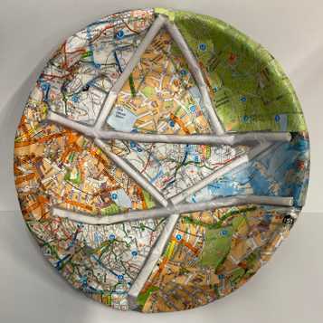 Paper mache bowl using a range of old maps and art straws