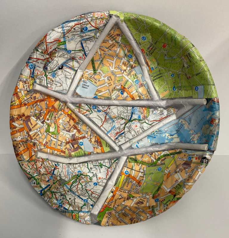 Paper mache bowl using a range of old maps and art straws