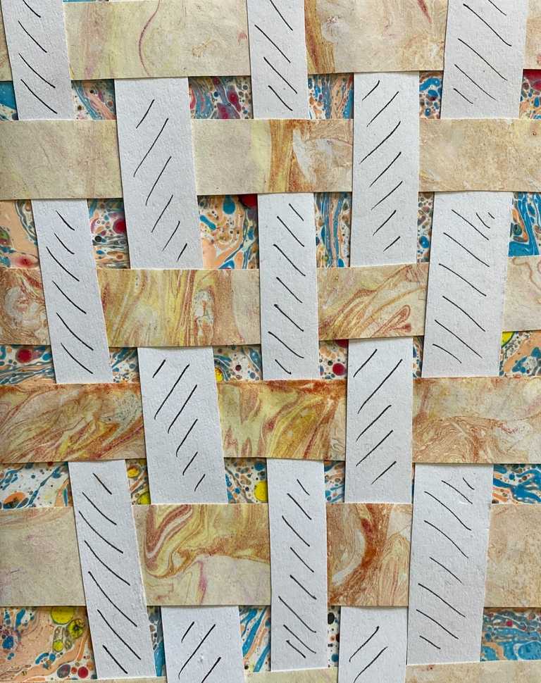 Weaving using marbled paper and white paper with mark making